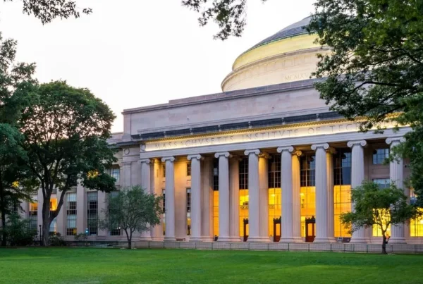 MIT building framed by trees