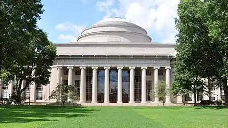 Columned MIT building framed by trees, home to the Chief Technology Officer program