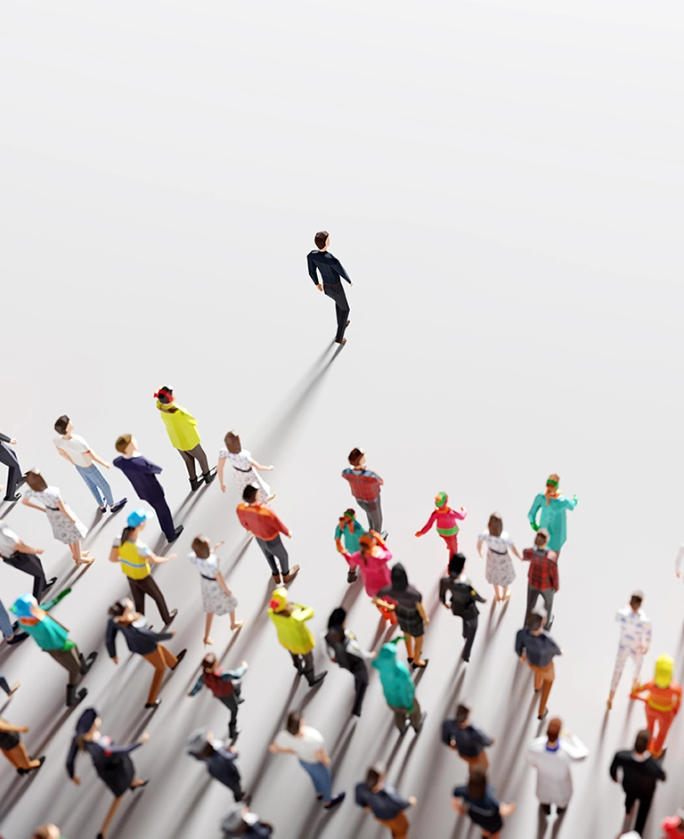 Group of people following a person walking ahead